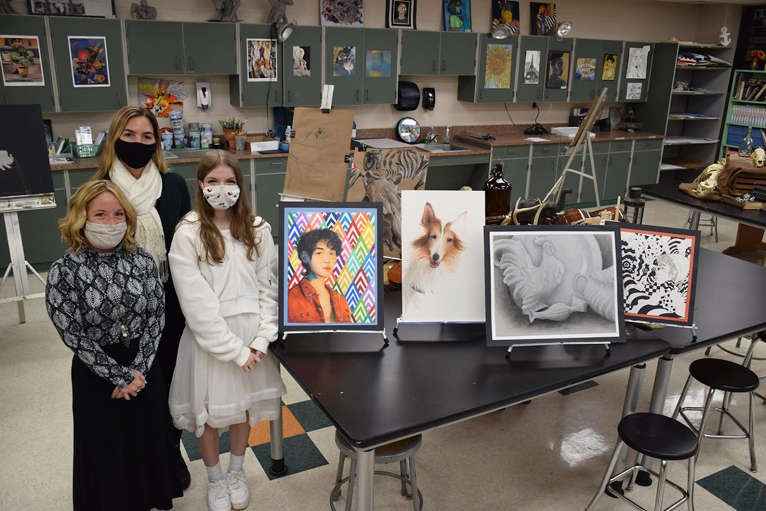Hailey Green (right) with her art teachers Theresa Bianco (left) and Erika Licausi (center) pictured with some of her artwork. 